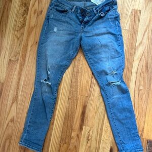 Levi’s 711 skinny distressed jeans